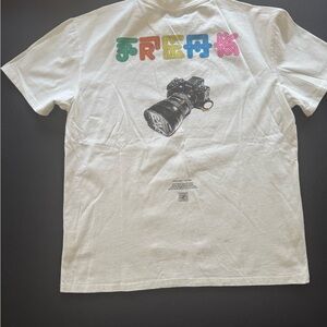 White Graphic Tee with Colorful 'FREE' Lettering and Camera Print